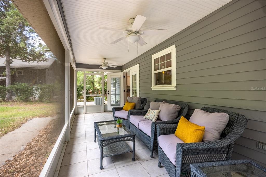 5028 Southwest 47th Street Gainesville, FL 32608 - Photo 16 of 49 a balcony with furniture and a potted plant