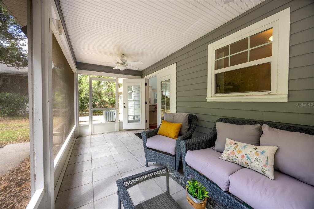 5028 Southwest 47th Street Gainesville, FL 32608 - Photo 17 of 49 a balcony with furniture and a potted plant