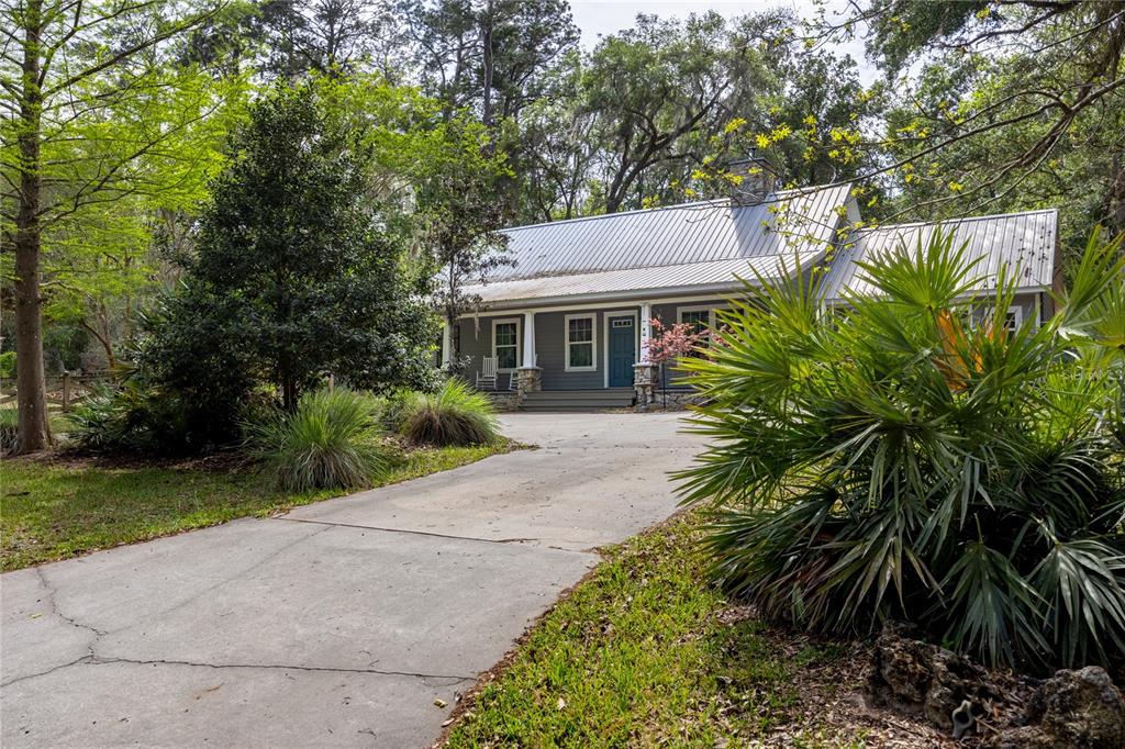 5028 Southwest 47th Street Gainesville, FL 32608 - Photo 19 of 49 a front view of house with yard and green space