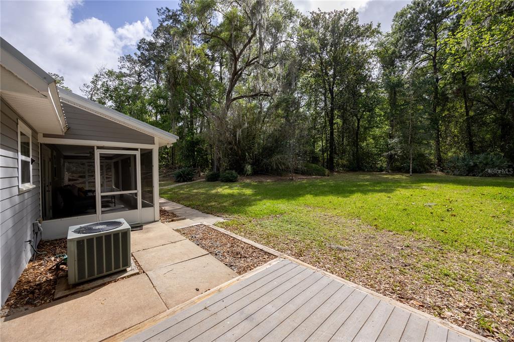 5028 Southwest 47th Street Gainesville, FL 32608 - Photo 20 of 49 a view of a house with backyard and sitting area