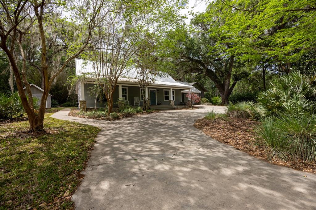 5028 Southwest 47th Street Gainesville, FL 32608 - Photo 2 of 49 a front view of a house with a yard