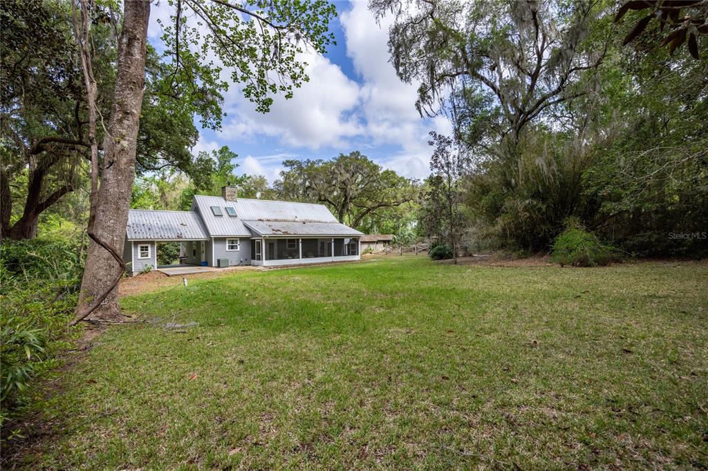 5028 Southwest 47th Street Gainesville, FL 32608 - Photo 21 of 49 a view of a house with a big yard