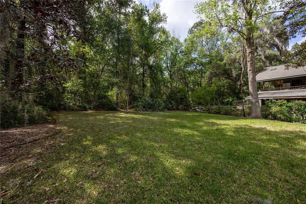 5028 Southwest 47th Street Gainesville, FL 32608 - Photo 25 of 49 a view of outdoor space with deck and yard