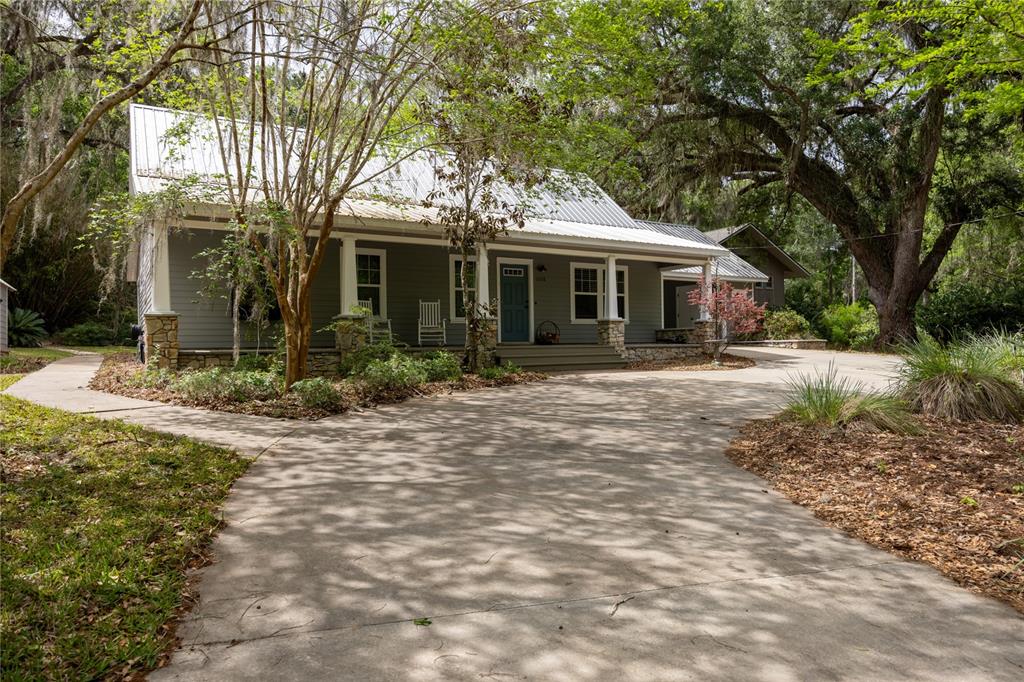 5028 Southwest 47th Street Gainesville, FL 32608 - Photo 3 of 49 a front view of a house with a yard