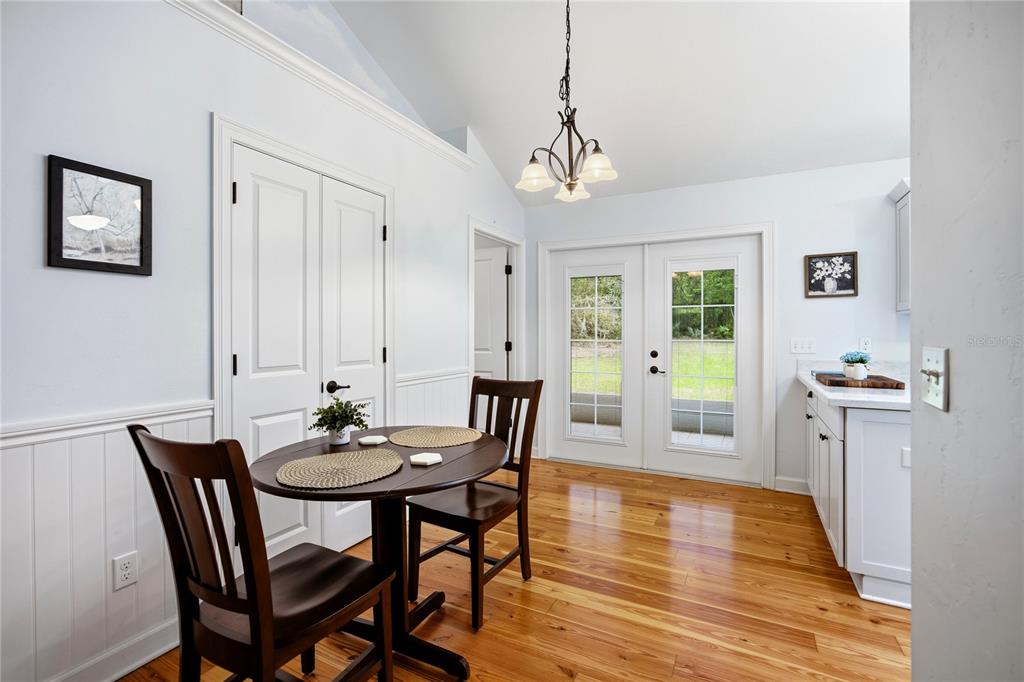 5028 Southwest 47th Street Gainesville, FL 32608 - Photo 32 of 49 a view of a dining room with furniture window and wooden floor