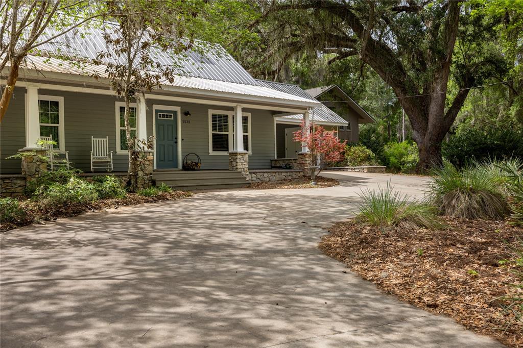 5028 Southwest 47th Street Gainesville, FL 32608 - Photo 4 of 49 a front view of a house with garden