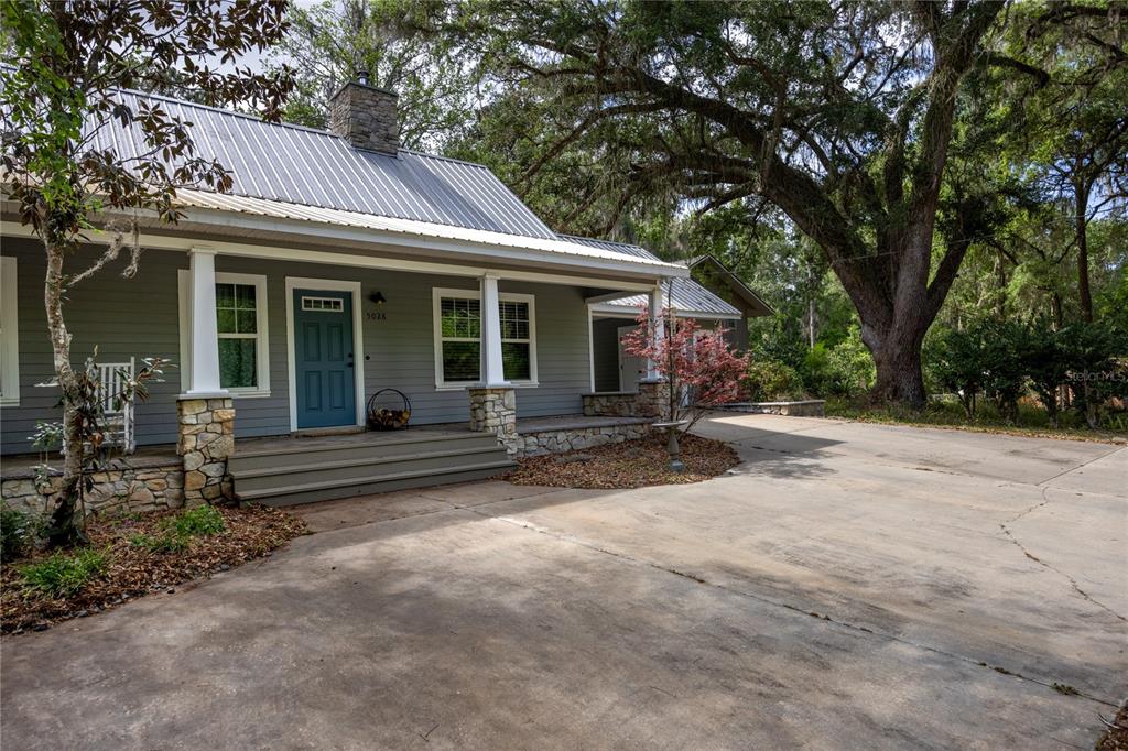 5028 Southwest 47th Street Gainesville, FL 32608 - Photo 7 of 49 a view of a house with backyard and sitting area