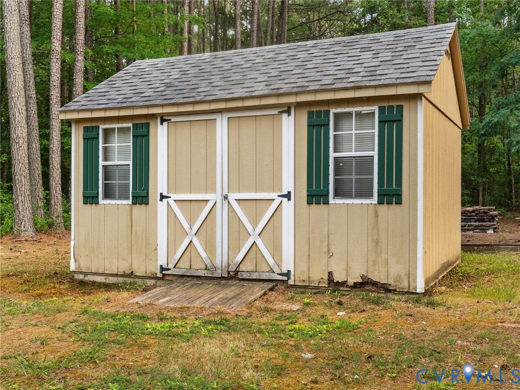 14175 Lebanon Road Disputanta, VA 23842 - Photo 46 of 60 Utility shed featuring a shingled gable roof, two