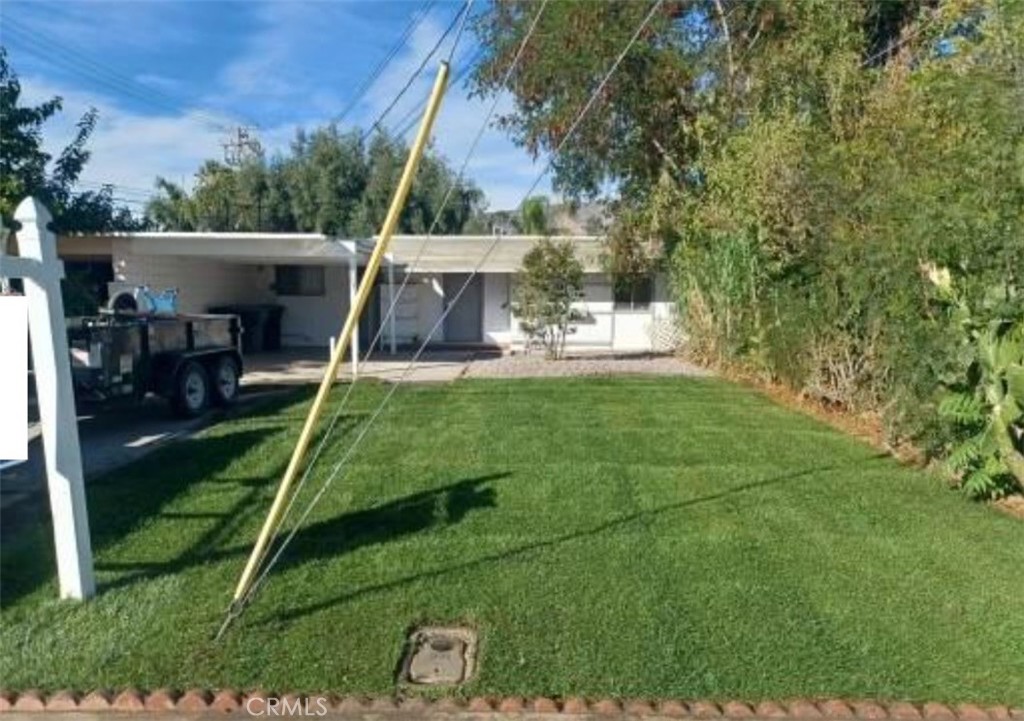 a view of a backyard with a slide