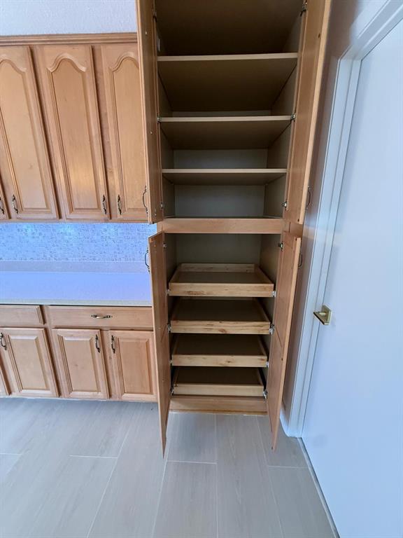 2911 Southwest 22nd Circle, Unit 37B Delray Beach, FL 33445 - Photo 12 of 51 a view of walk in closet with empty racks