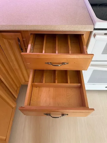 a room with a sink a washer and dryer