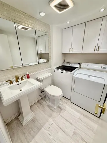 a utility room with washer and dryer