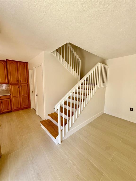 2911 Southwest 22nd Circle, Unit 37B Delray Beach, FL 33445 - Photo 19 of 51 a view of an empty room with stairs