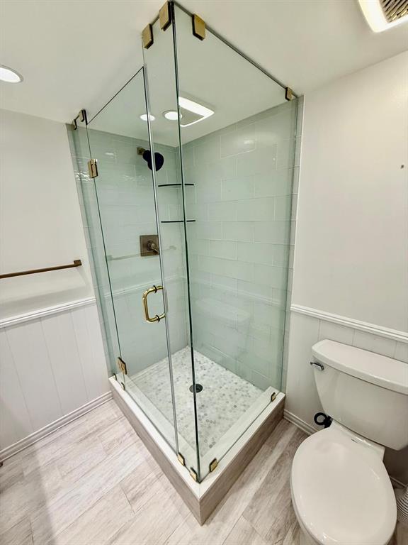 2911 Southwest 22nd Circle, Unit 37B Delray Beach, FL 33445 - Photo 27 of 51 a bathroom with a toilet and a shower