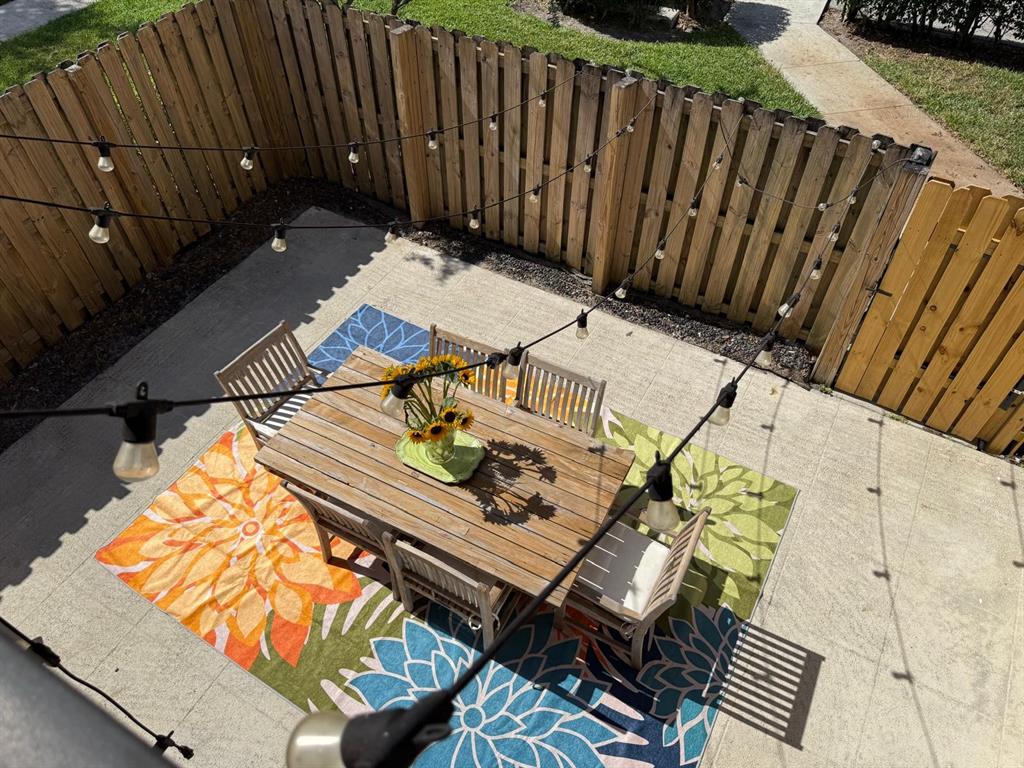 2911 Southwest 22nd Circle, Unit 37B Delray Beach, FL 33445 - Photo 30 of 51 a view of a patio with wooden floor
