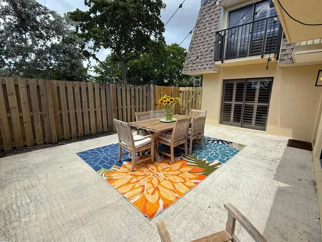 a view of a outdoor sitting area with furniture