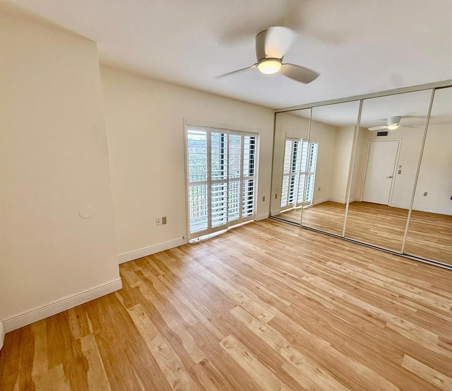 2911 Southwest 22nd Circle, Unit 37B Delray Beach, FL 33445 - Photo 35 of 51 wooden floor in an empty room with a window