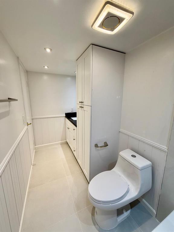 2911 Southwest 22nd Circle, Unit 37B Delray Beach, FL 33445 - Photo 39 of 51 a bathroom with a toilet and a shower