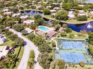 2911 Southwest 22nd Circle, Unit 37B Delray Beach, FL 33445 - Photo 47 of 51 an aerial view of residential houses with outdoor space
