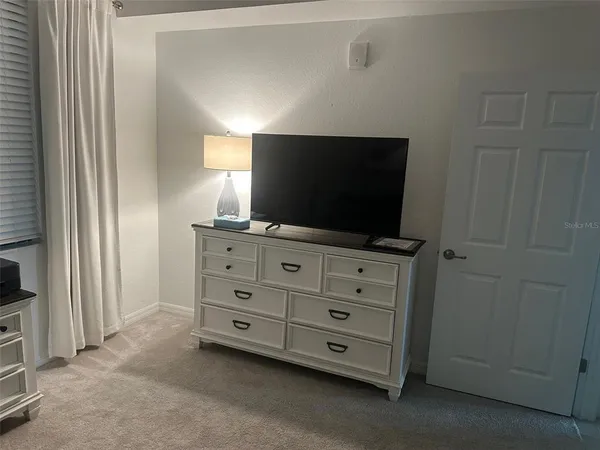 a room with furniture and flat screen tv