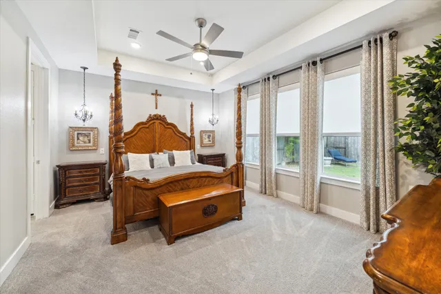 a bed room with a bed and a chair