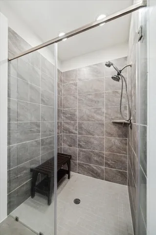 a bathroom with a shower and a sink