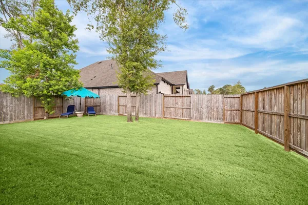 a view of a backyard with a garden
