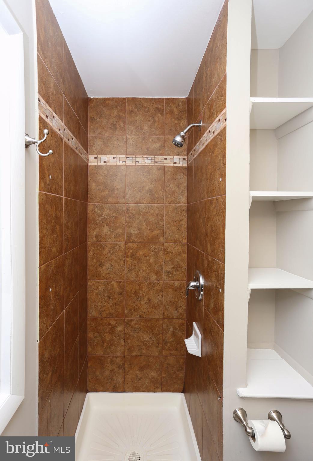 512 Crosby Road Baltimore, MD 21228 - Photo 14 of 30 a bathroom with a shower