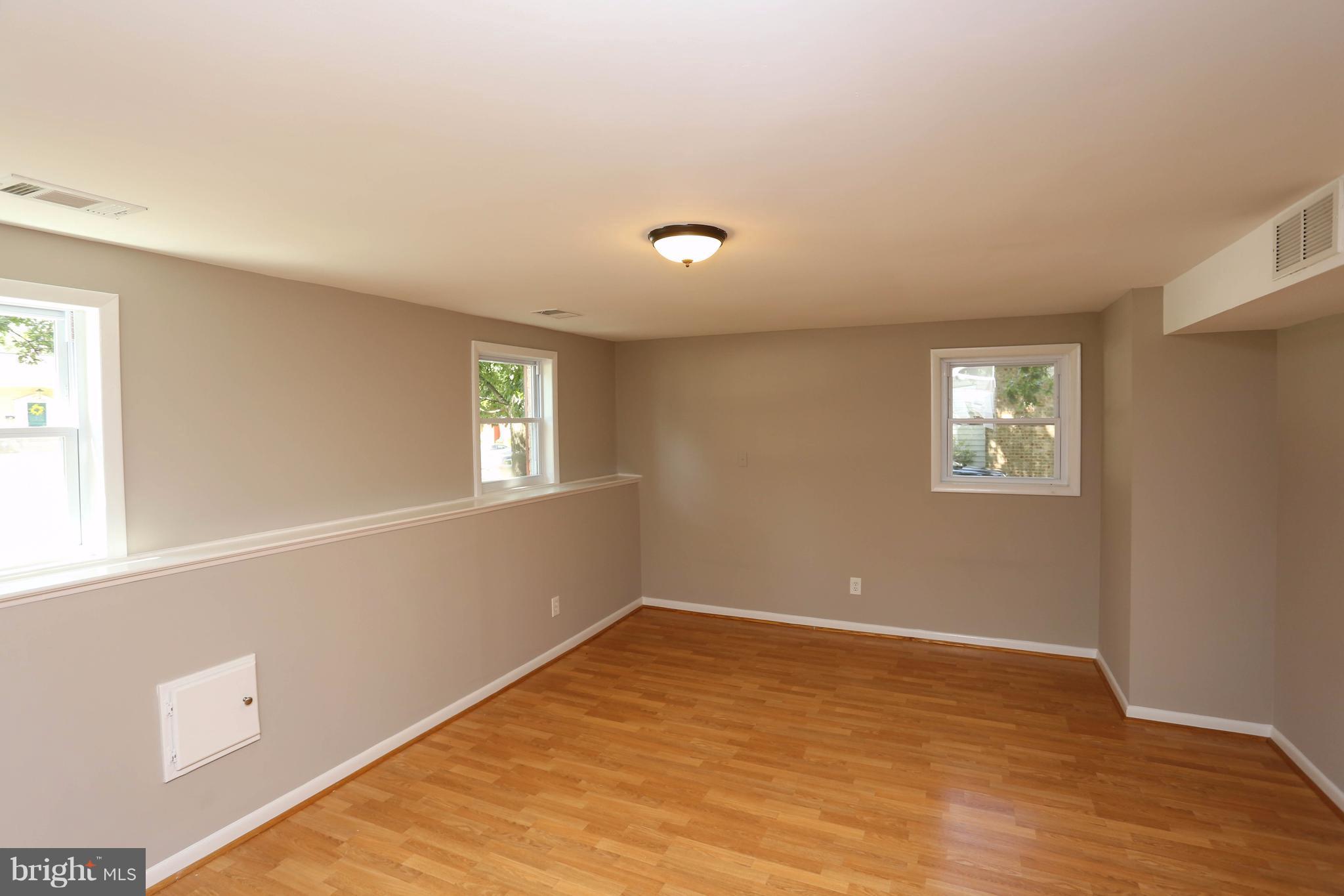 512 Crosby Road Baltimore, MD 21228 - Photo 20 of 30 a view of an empty room with a window