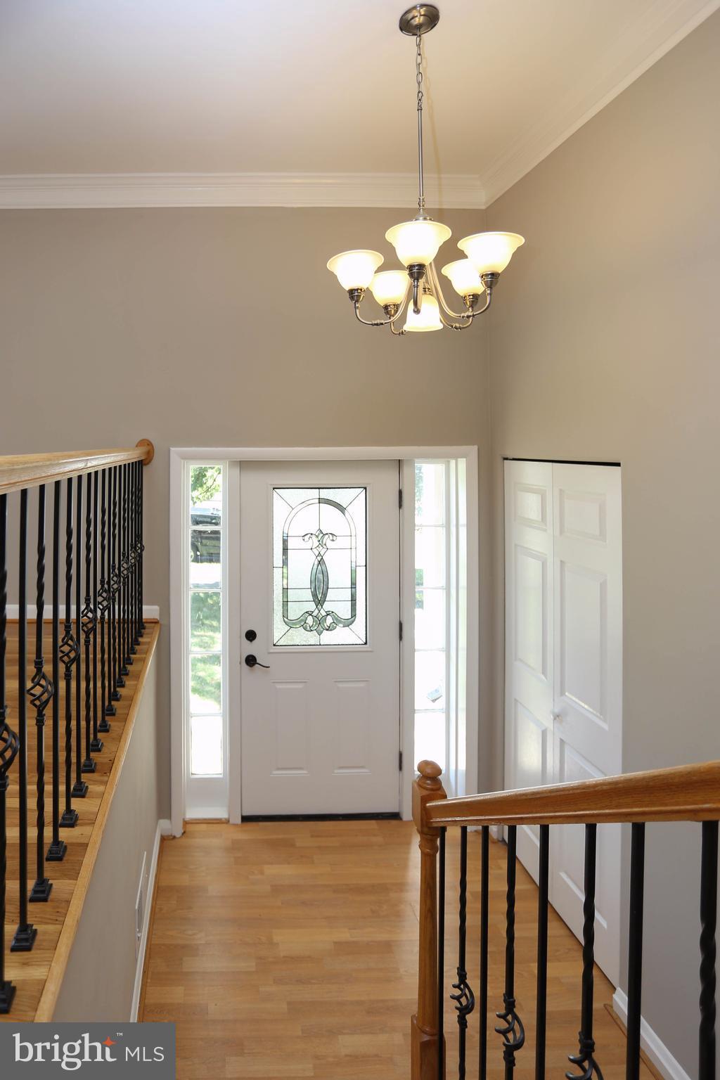 512 Crosby Road Baltimore, MD 21228 - Photo 3 of 30 a view of a chandelier fan and wooden floor