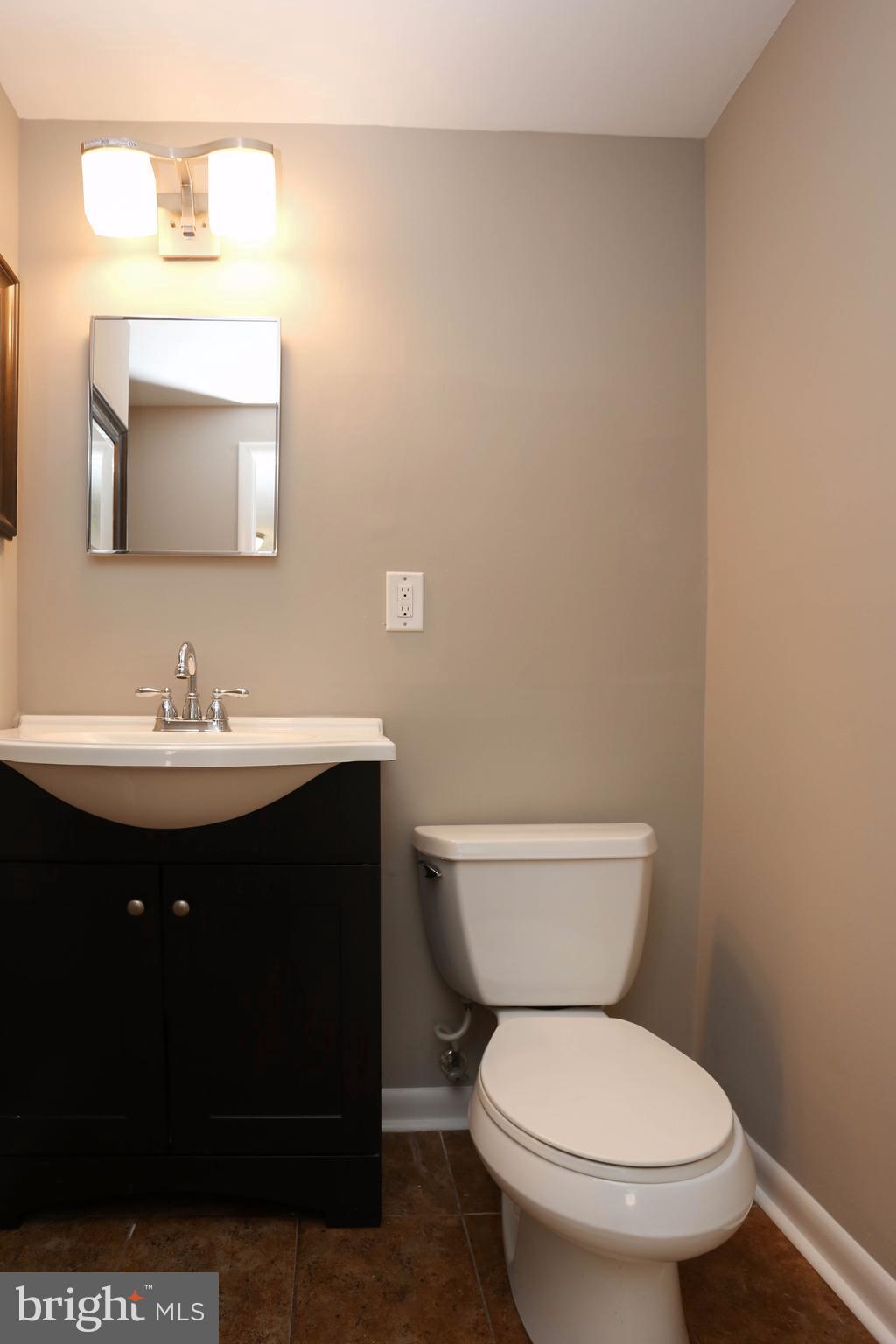 512 Crosby Road Baltimore, MD 21228 - Photo 22 of 30 a bathroom with a sink and a toilet