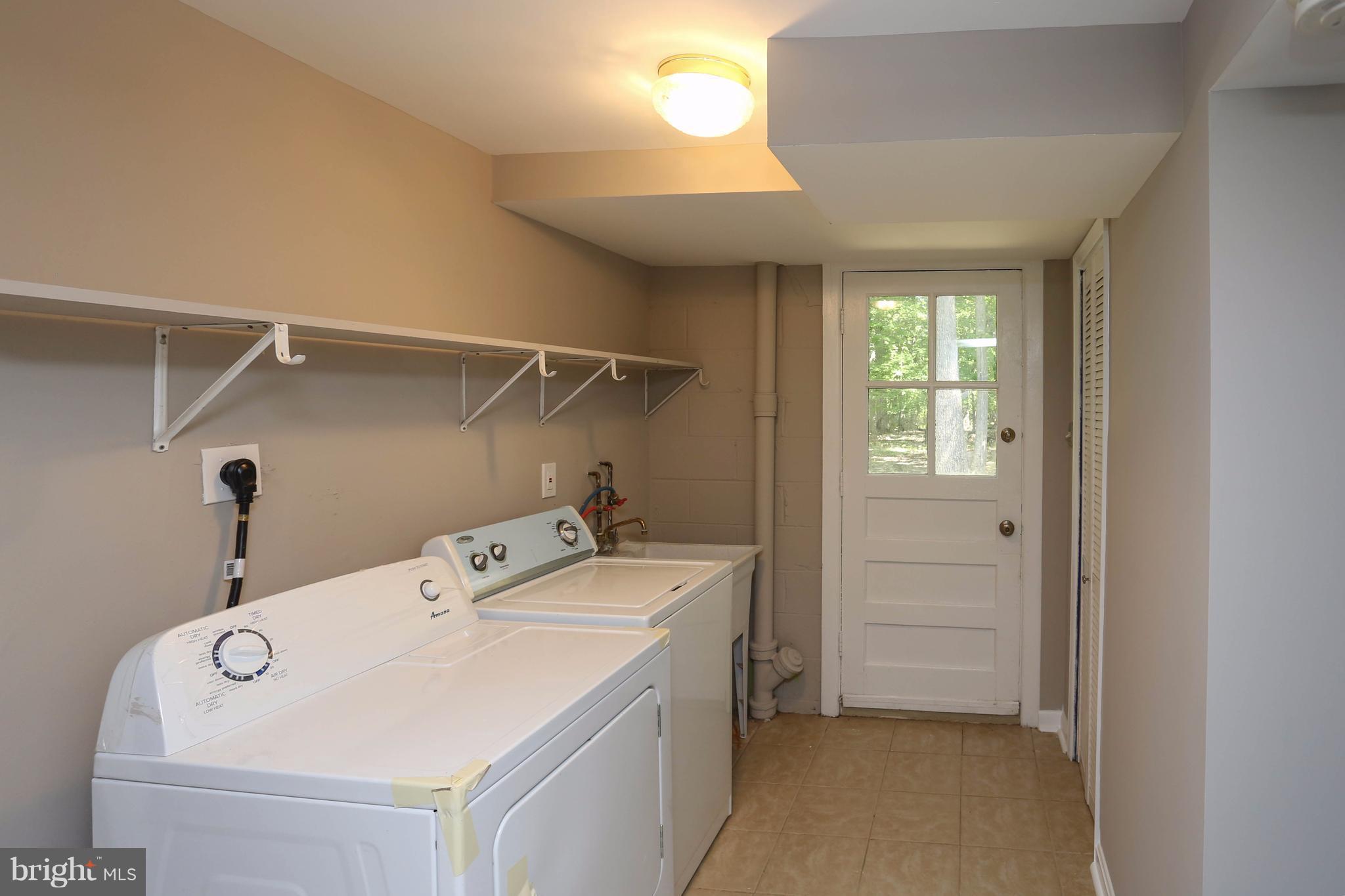 512 Crosby Road Baltimore, MD 21228 - Photo 25 of 30 a utility room with dryer and washer
