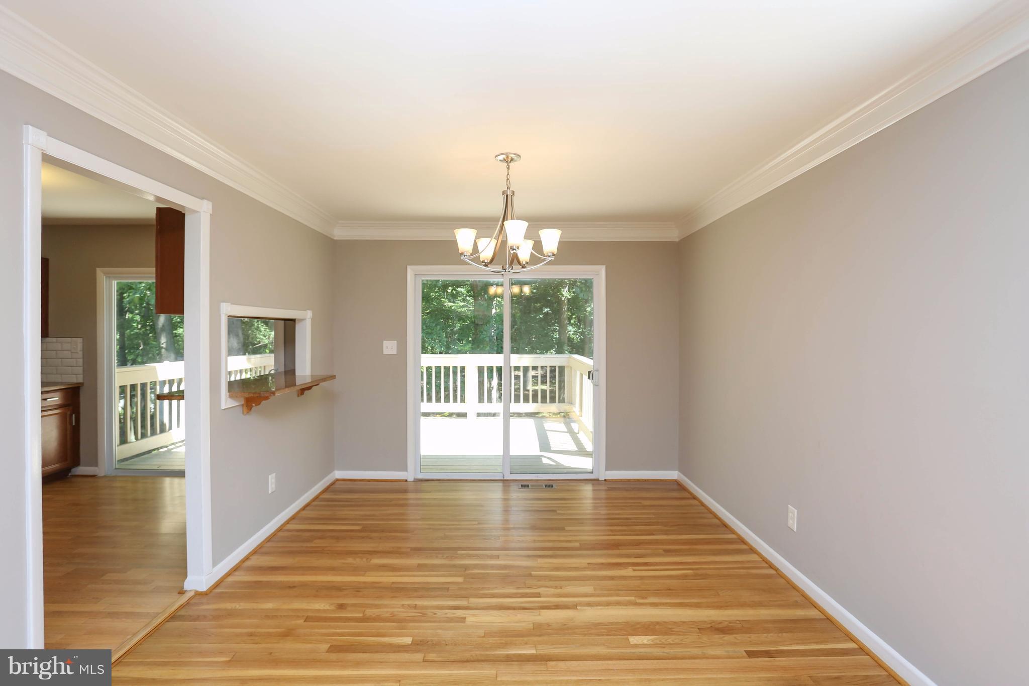 512 Crosby Road Baltimore, MD 21228 - Photo 7 of 30 a view of an empty room with glass door