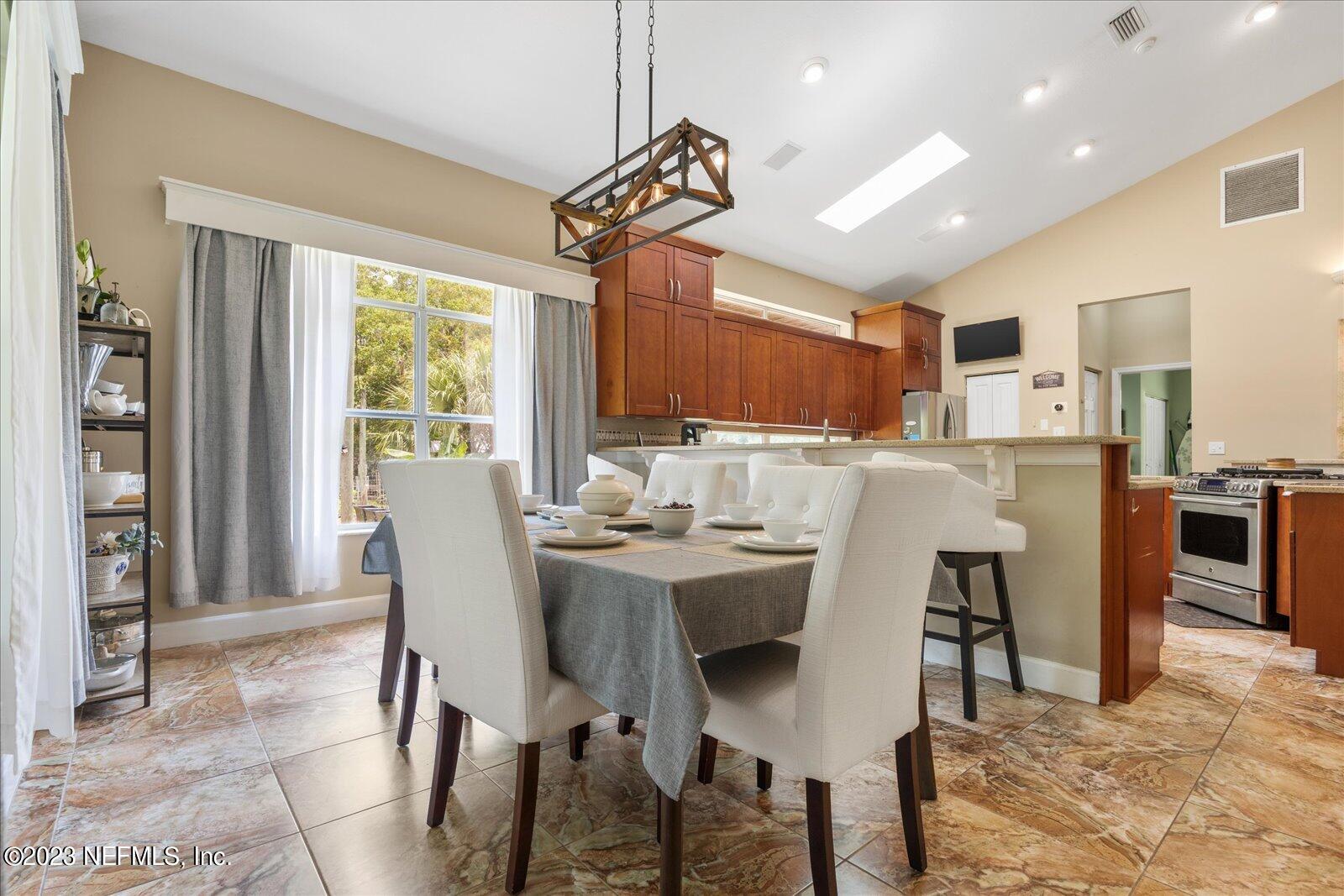 1100 Oak Ridge Road St. Augustine, FL 32086 - Photo 21 of 95 a view of a dining room with furniture