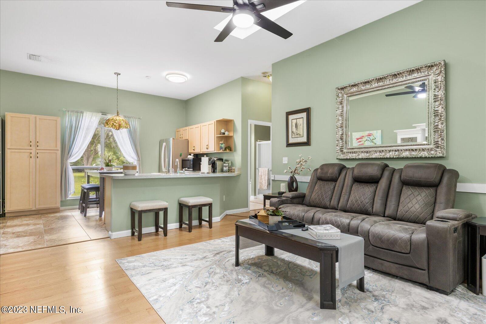 1100 Oak Ridge Road St. Augustine, FL 32086 - Photo 30 of 95 a living room with furniture and a table