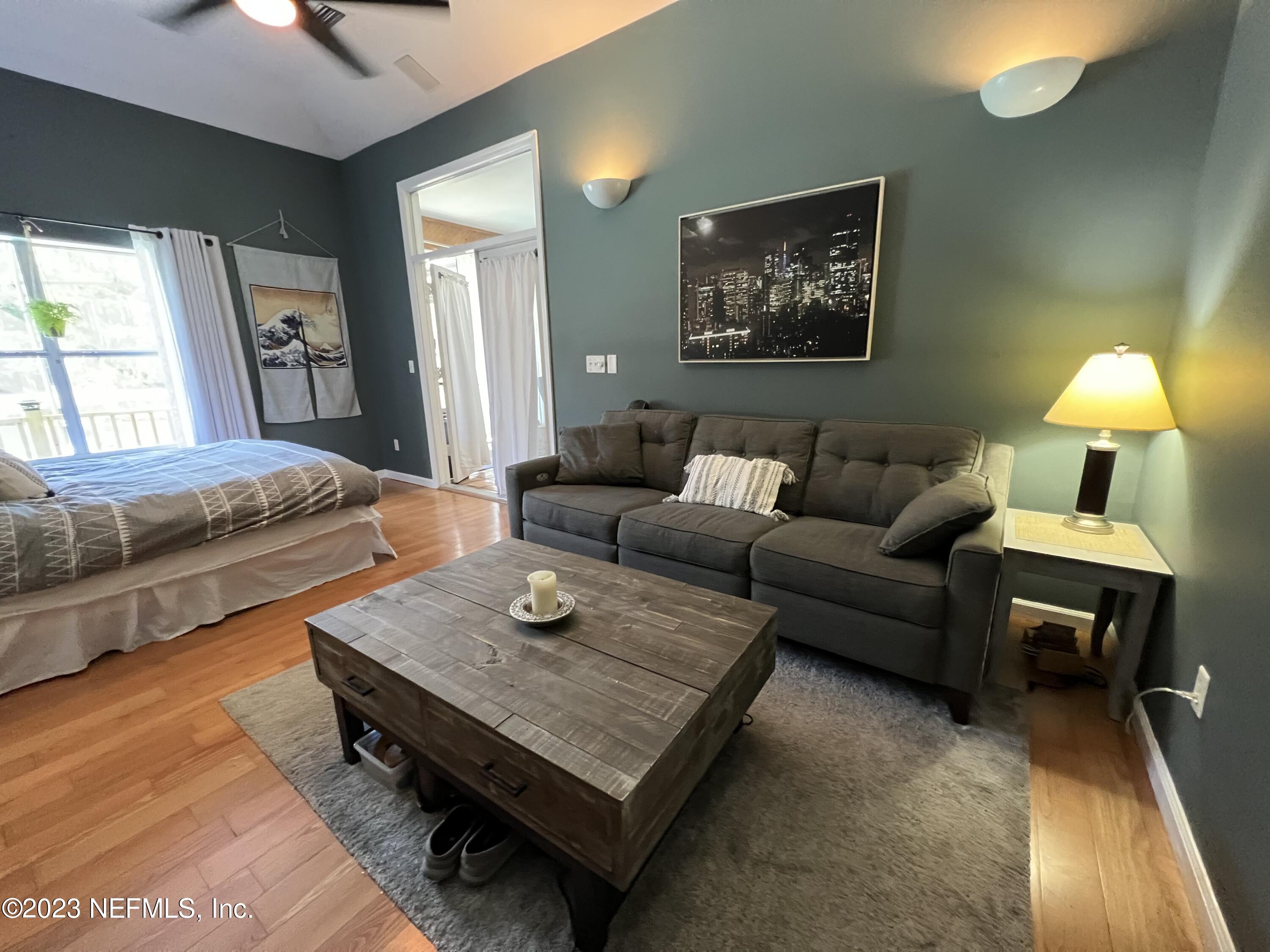 1100 Oak Ridge Road St. Augustine, FL 32086 - Photo 38 of 95 a living room with furniture and a rug