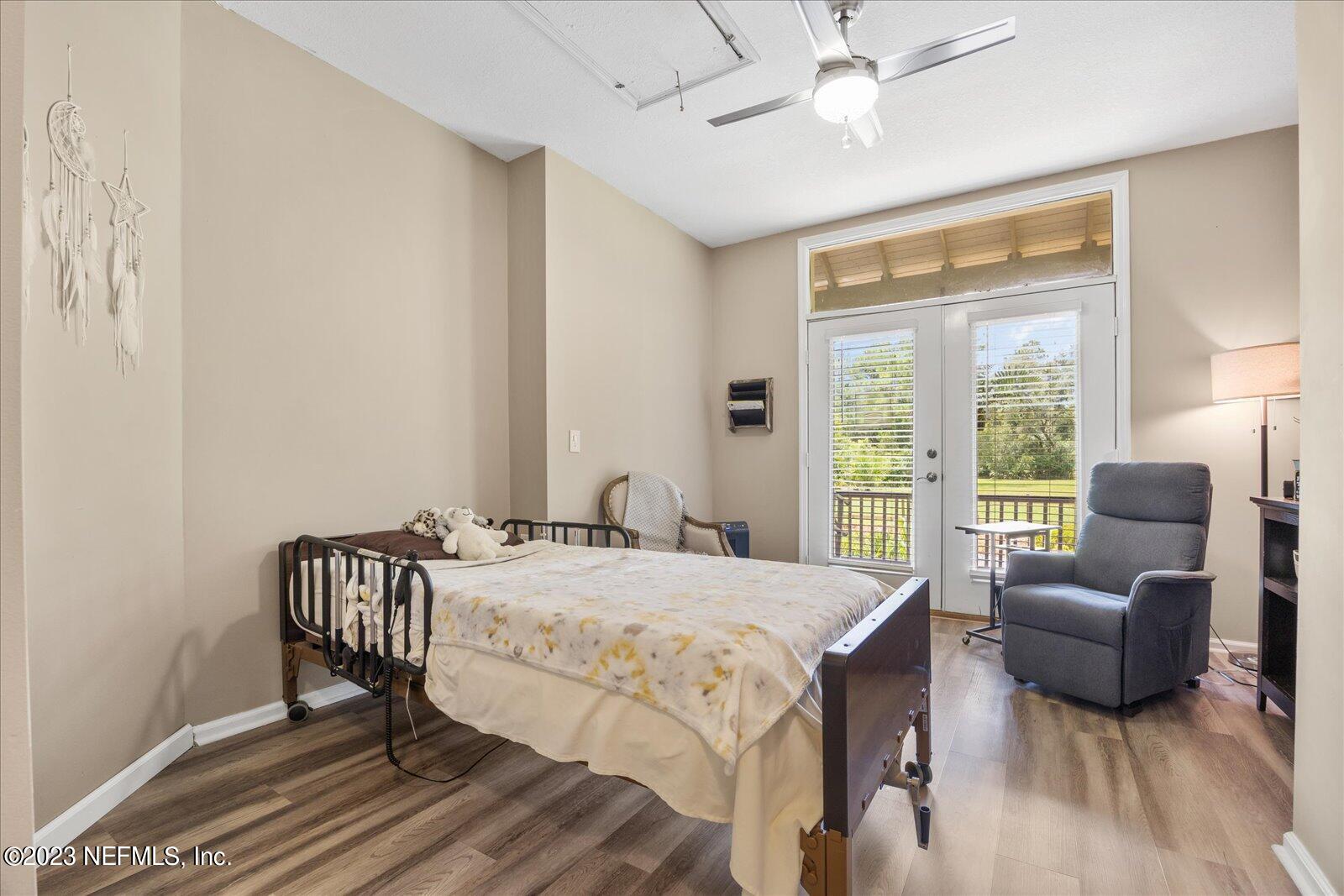 1100 Oak Ridge Road St. Augustine, FL 32086 - Photo 45 of 95 a bedroom with a bed and a view of balcony