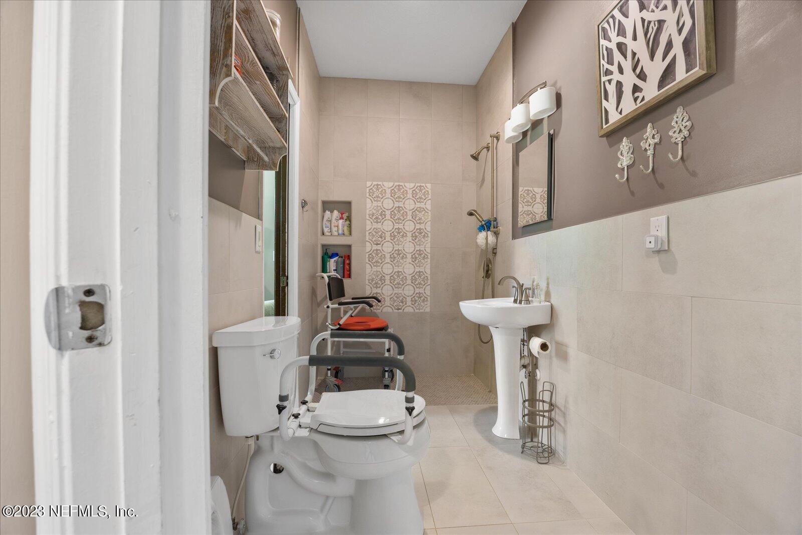1100 Oak Ridge Road St. Augustine, FL 32086 - Photo 46 of 95 a bathroom with a sink toilet and shower