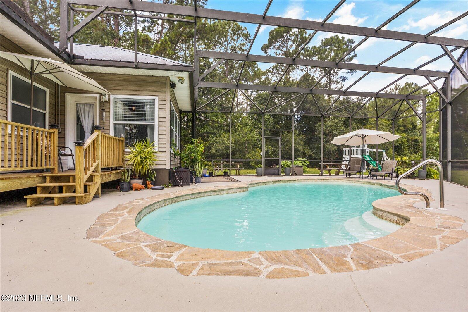1100 Oak Ridge Road St. Augustine, FL 32086 - Photo 60 of 95 a view of outdoor space yard swimming pool and seating