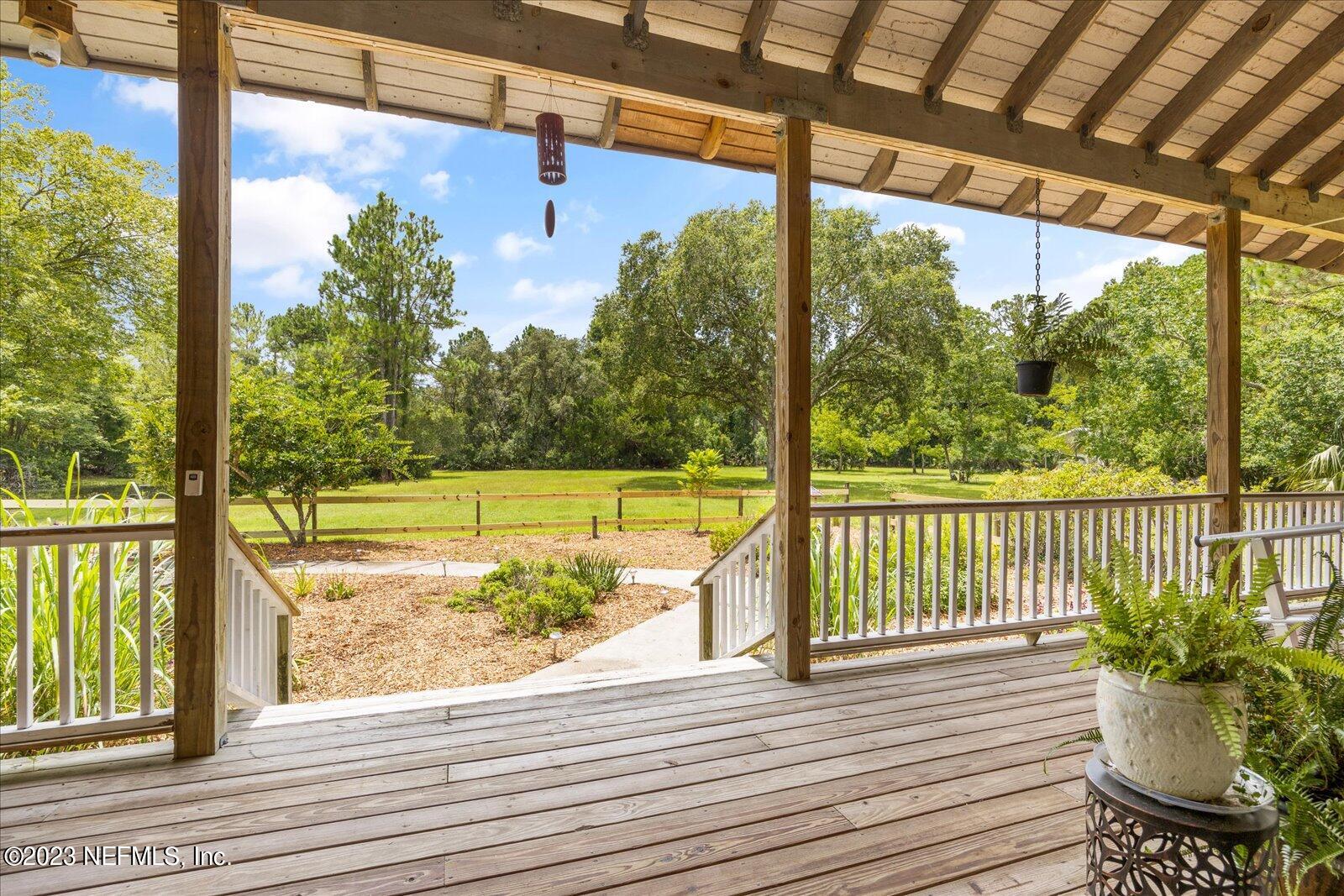 1100 Oak Ridge Road St. Augustine, FL 32086 - Photo 74 of 95 a view of a balcony with lake view and a potted plant
