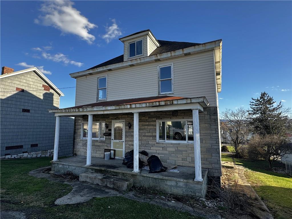 92 2nd Street Uniontown, PA 15401 - Photo 2 of 10 a front view of a house with garden