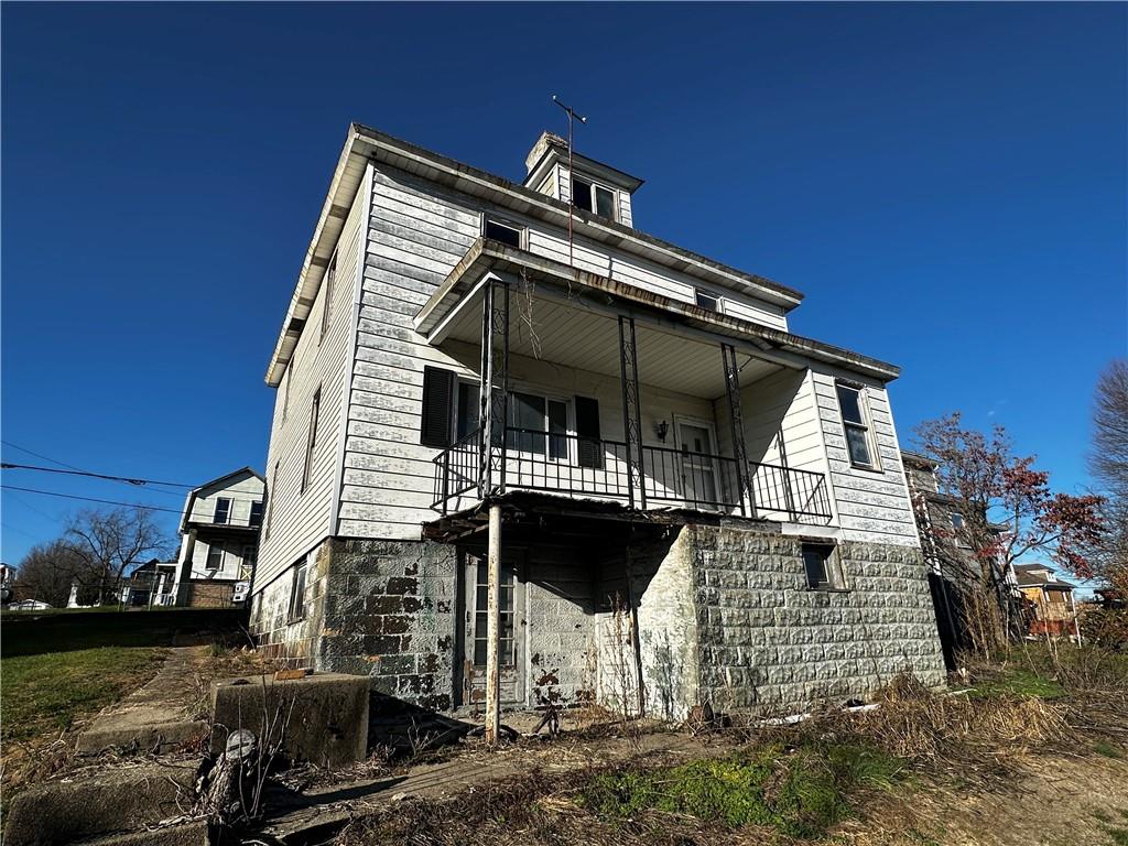 92 2nd Street Uniontown, PA 15401 - Photo 3 of 10 a view of a house with a balcony