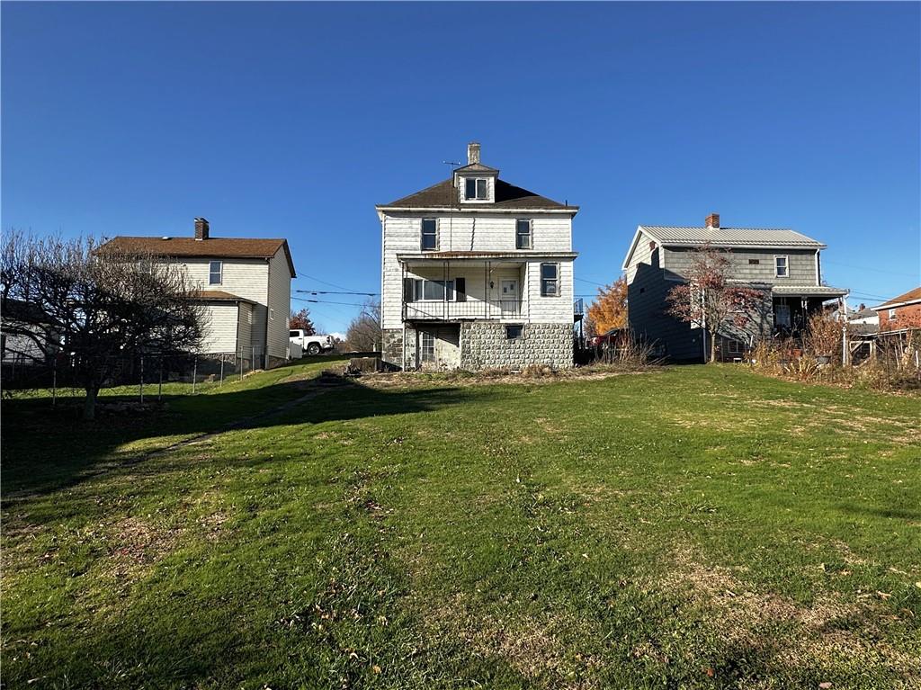 92 2nd Street Uniontown, PA 15401 - Photo 4 of 10 a front view of a house with garden