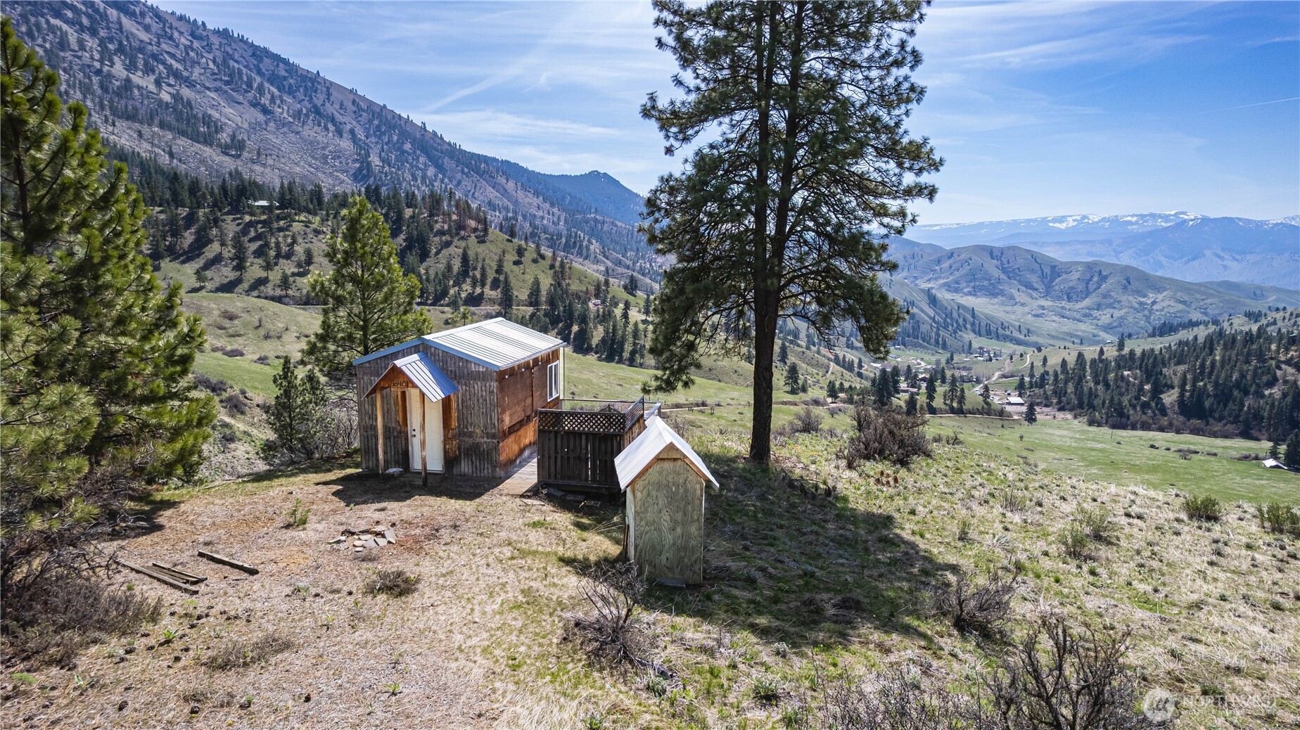 9640 Nahahum Canyon Road Cashmere, WA 98815 - Photo 13 of 25 a view of a backyard with plants and a yard
