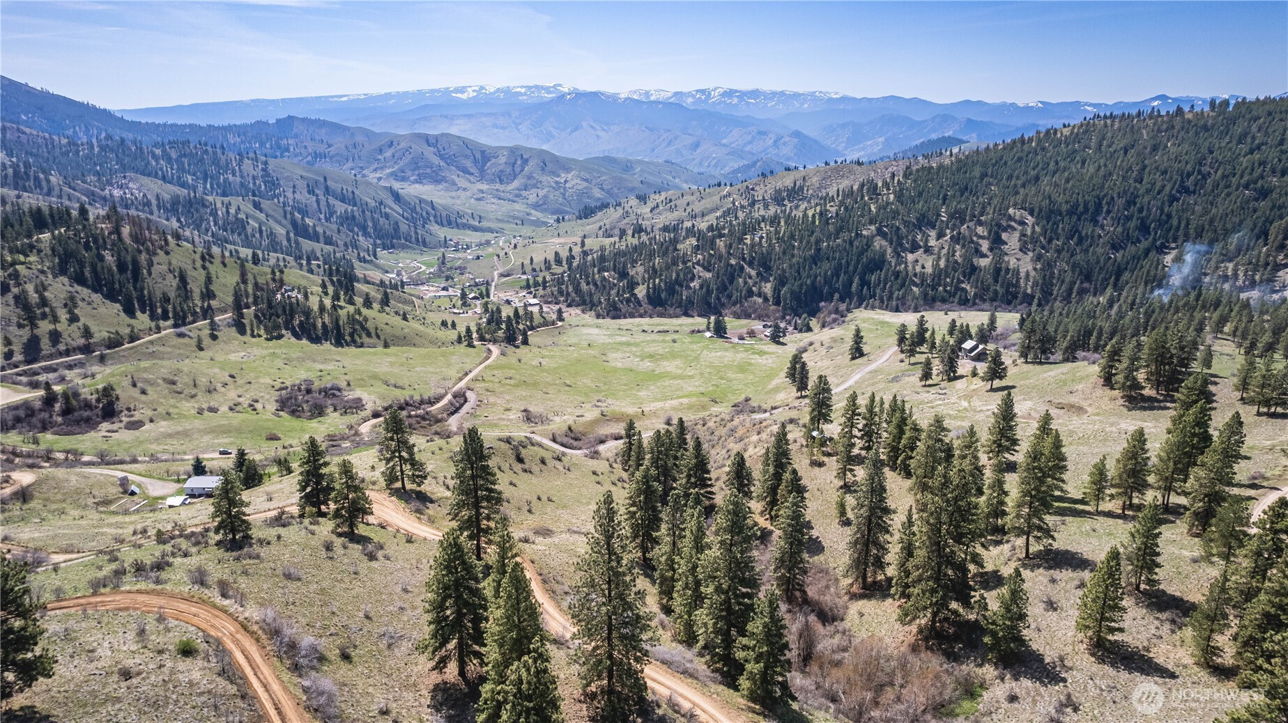 9640 Nahahum Canyon Road Cashmere, WA 98815 - Photo 15 of 25 a view of a backyard with mountains