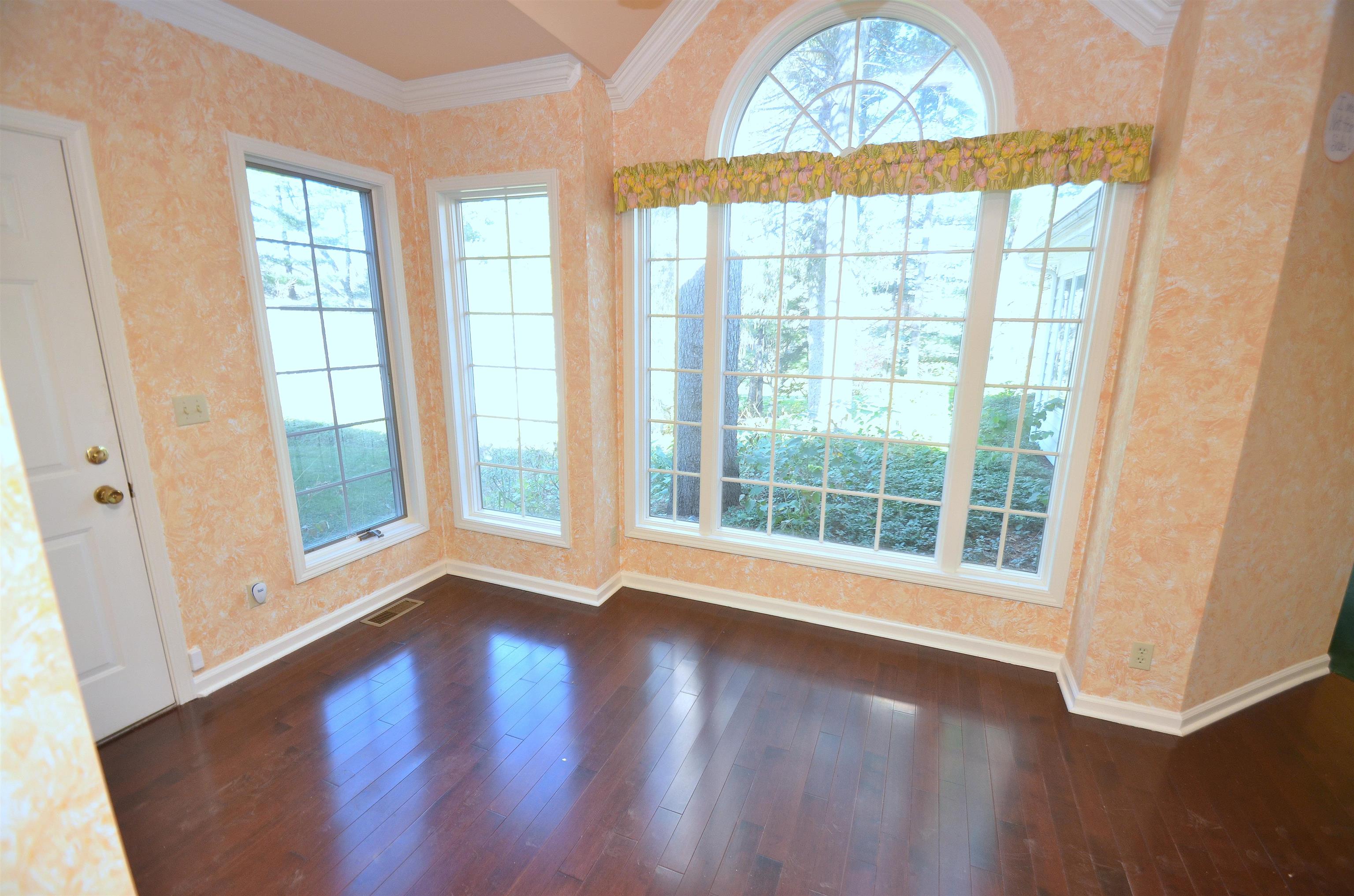 4980 Spring Brook Road Rockford, IL 61114 - Photo 12 of 50 an empty room with wooden floor and windows