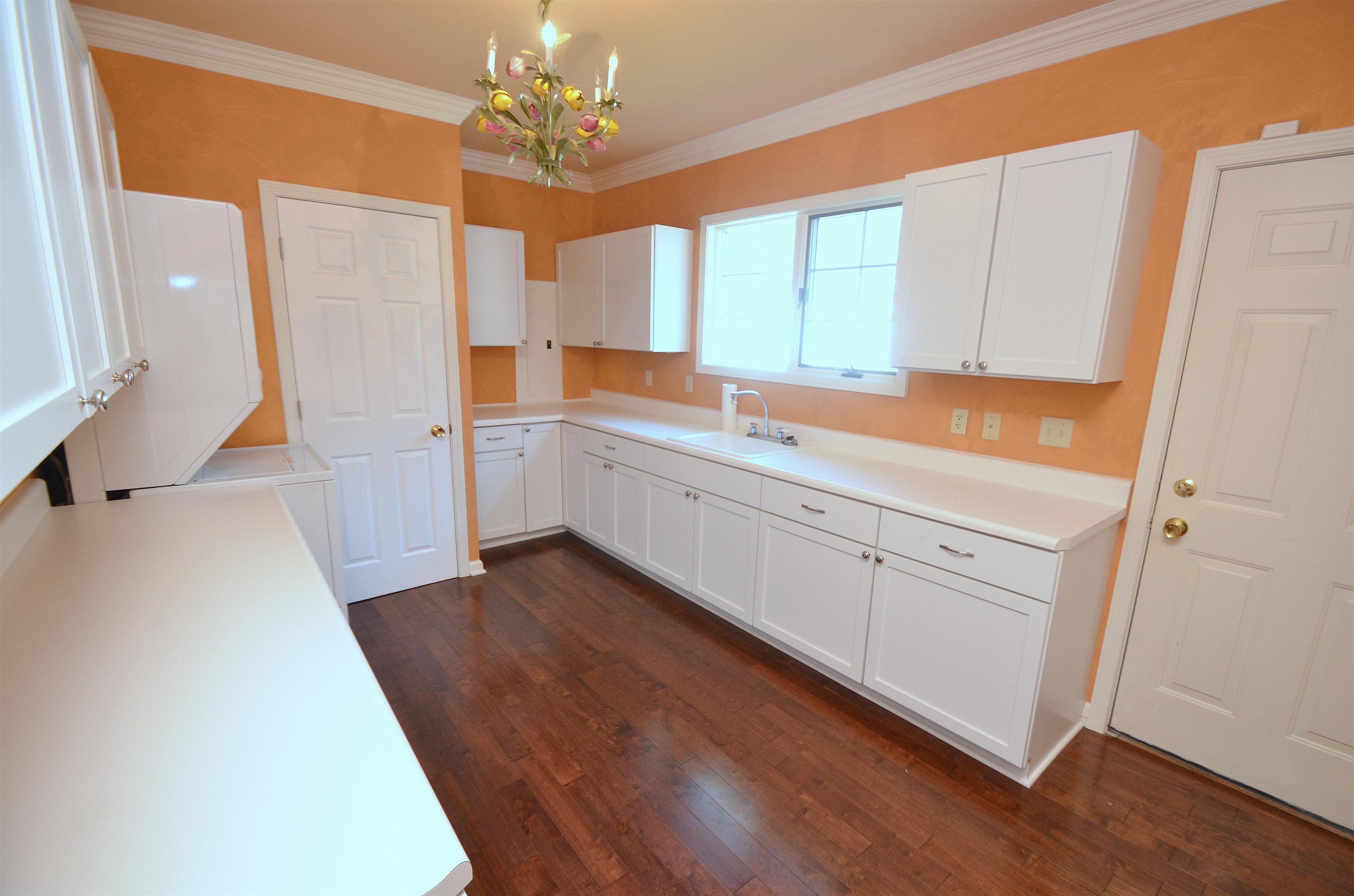 4980 Spring Brook Road Rockford, IL 61114 - Photo 19 of 50 a kitchen with white cabinets and sink