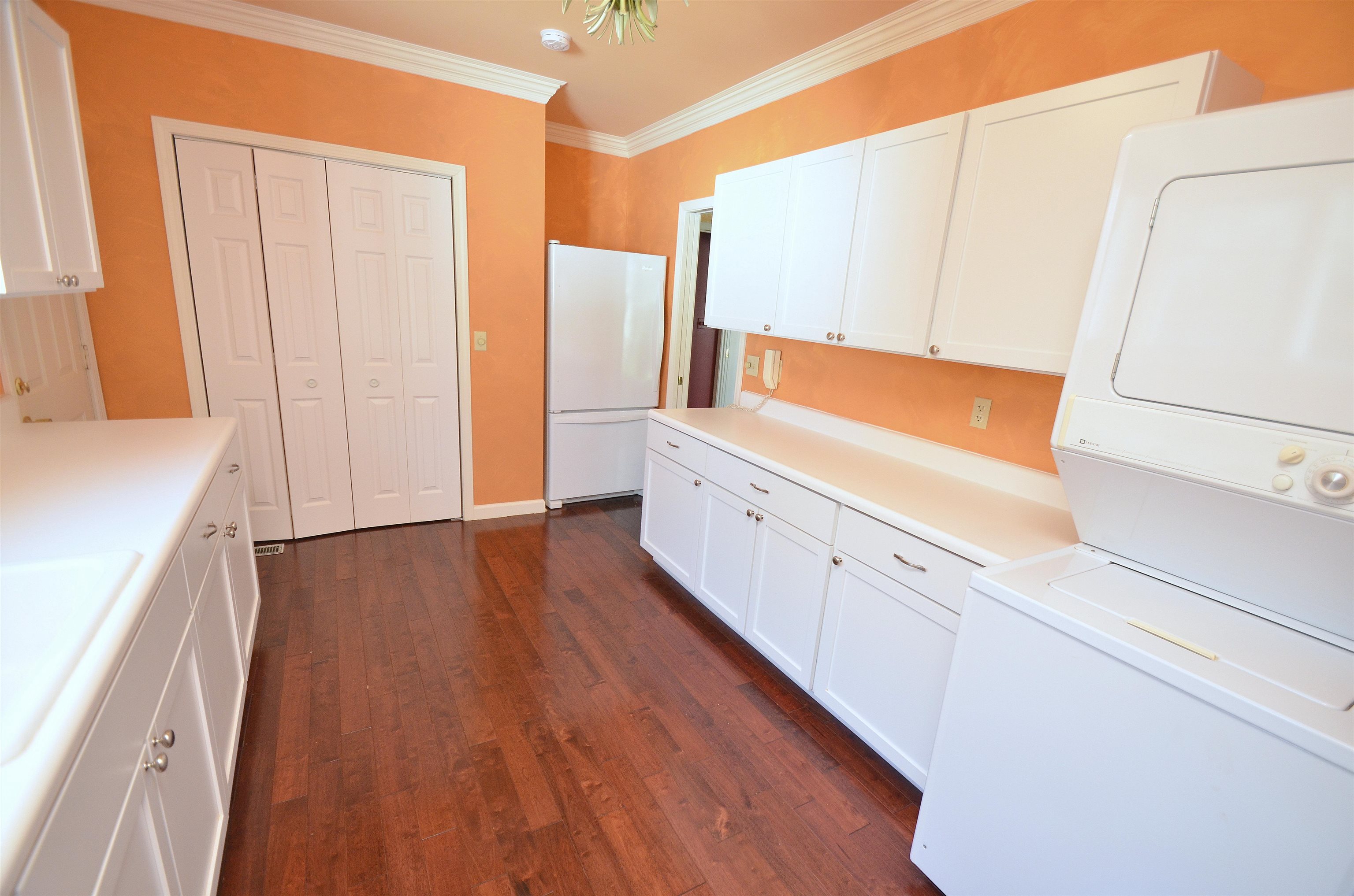 4980 Spring Brook Road Rockford, IL 61114 - Photo 21 of 50 a view of a kitchen with wooden floor and electronic appliances