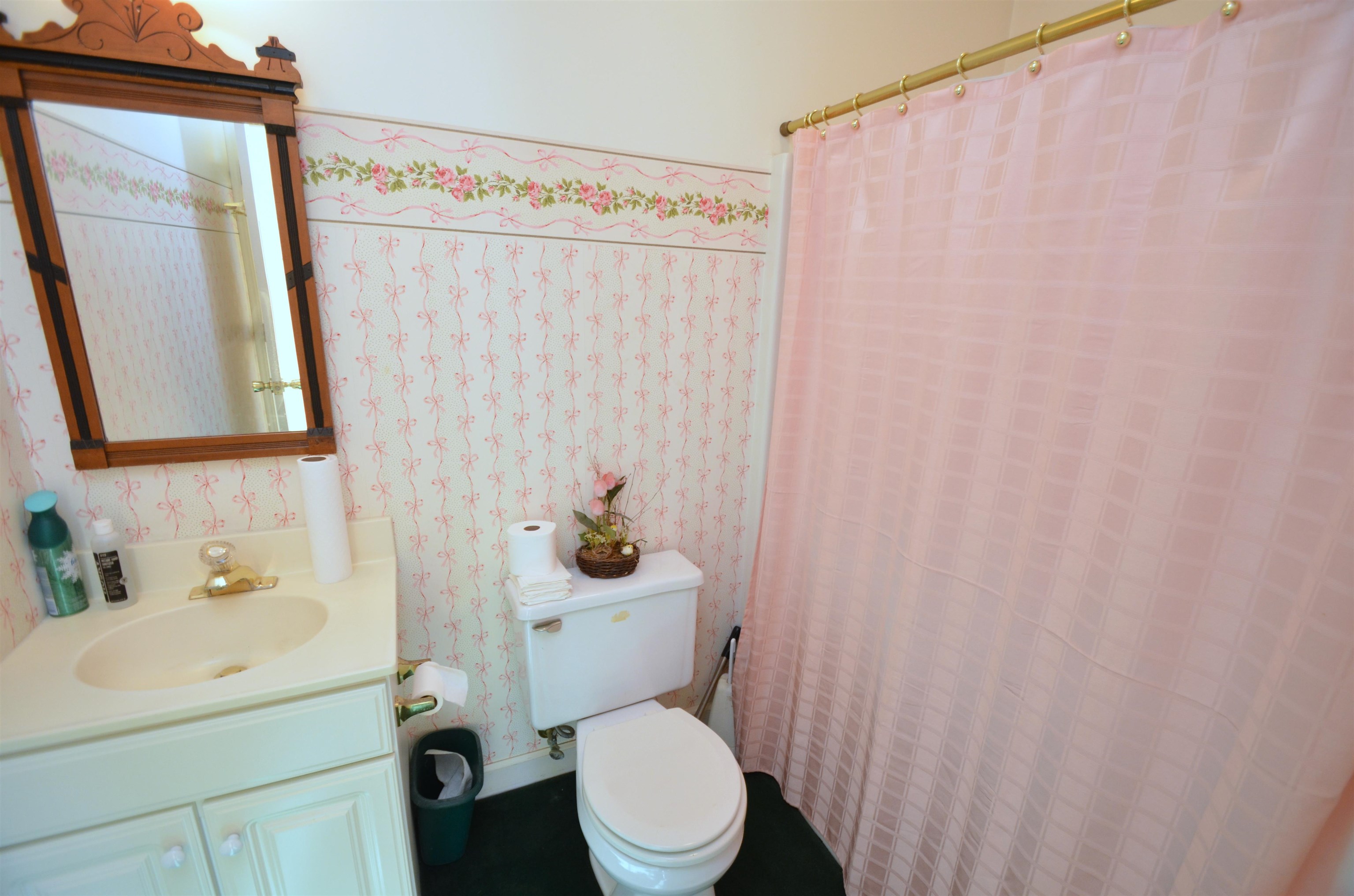 4980 Spring Brook Road Rockford, IL 61114 - Photo 30 of 50 a white toilet sitting next to a bathroom sink