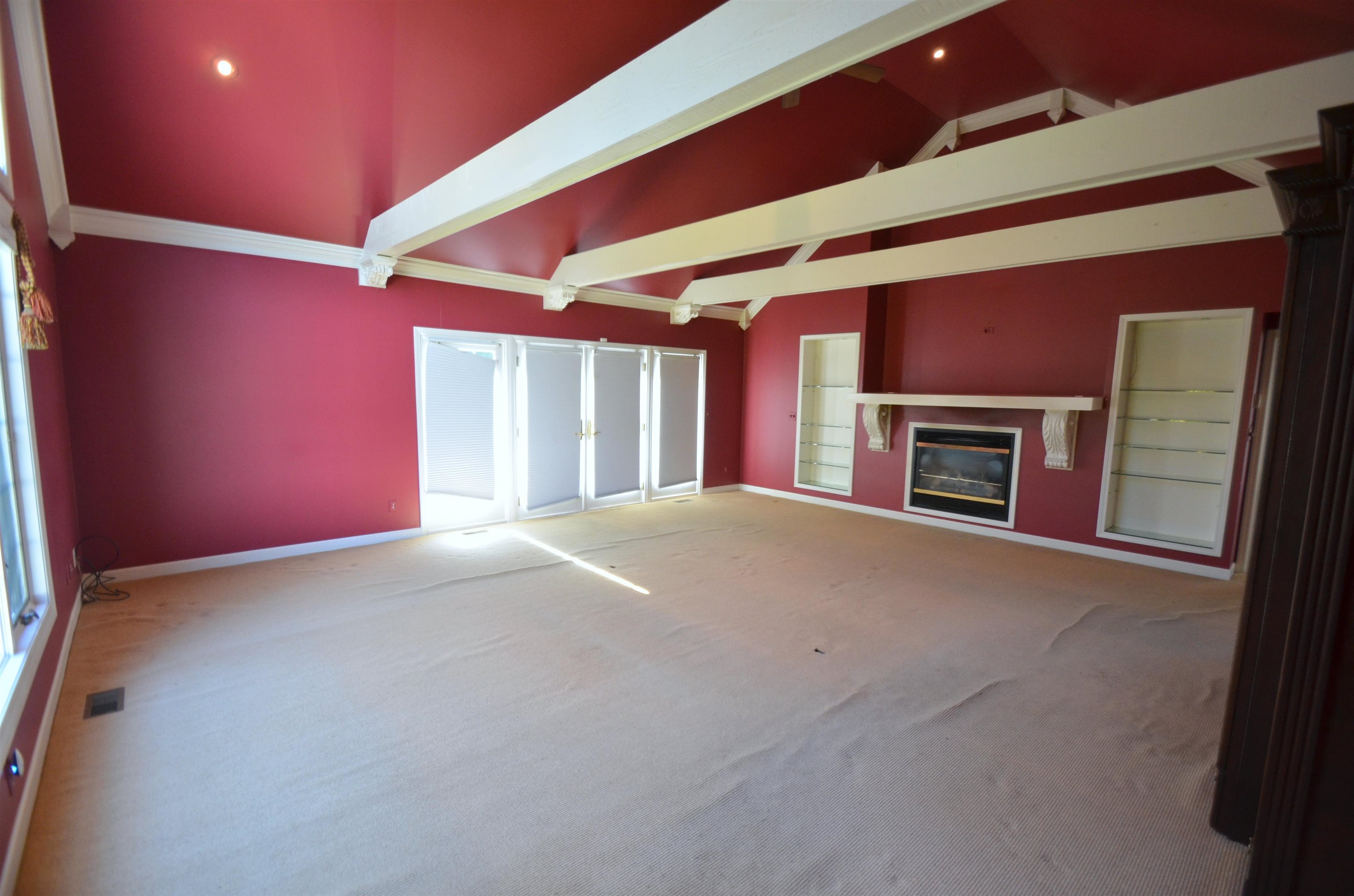 4980 Spring Brook Road Rockford, IL 61114 - Photo 31 of 50 a view of empty room with fireplace and a projector